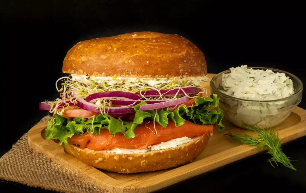 salmon-with-cream-cheese sandwich and cream cheese bowl on the side